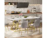 Mesa de comedor moderna con base dorada y sillas grises, ideal para 8 personas. Las medidas de la mesa comedor 8 personas son perfectas para reuniones familiares.