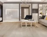 Suelos de madera clara, ideales para casas modernas. Un salón elegante con sofá, mesa de centro y estanterías.