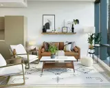 Sofá de cuero, sillas blancas y alfombra geométrica crean un ambiente moderno. Estilos de decoración que combinan confort y diseño.