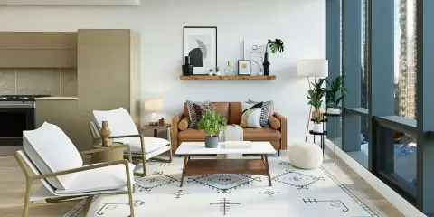 Sofá de cuero, sillas blancas y alfombra geométrica crean un ambiente moderno. Estilos de decoración que combinan confort y diseño.
