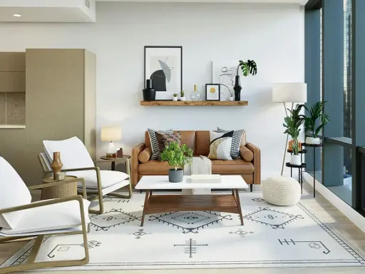 Sofá de cuero, sillas blancas y alfombra geométrica crean un ambiente moderno. Estilos de decoración que combinan confort y diseño.