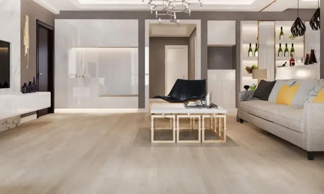 Suelos de madera clara, ideales para casas modernas. Un salón elegante con sofá, mesa de centro y estanterías.