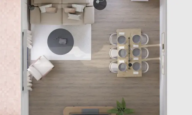 Vista aérea de un salón-comedor moderno. El salón tiene un sofá beige, mesa de centro redonda y sillón. El comedor, con mesa de madera y seis sillas, se ubica junto a la ventana. Las medidas del salón son ideales para este diseño.