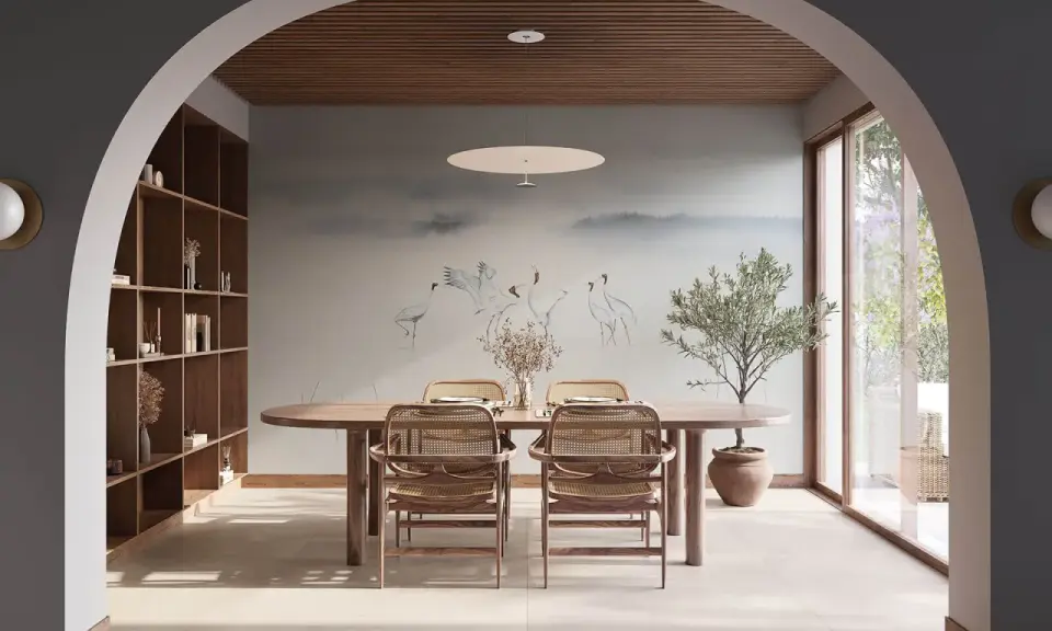 Comedor con mural de grullas, estantería de madera y mesa ovalada. Un espacio que evoca la armonía del feng shui.