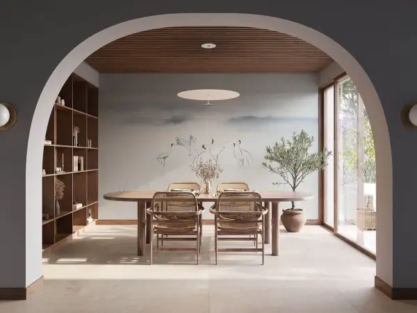 Comedor con mural de grullas, estantería de madera y mesa ovalada. Un espacio que evoca la armonía del feng shui.